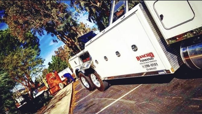 Heavy Duty Flatbed Towing Truck towing a forklift in Temecula CA - Rancho Towing
