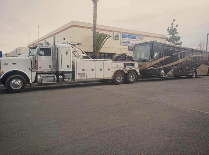 Heavy Duty Towing Truck Towing a Class A Motorhome in Temecula CA - Rancho Towing