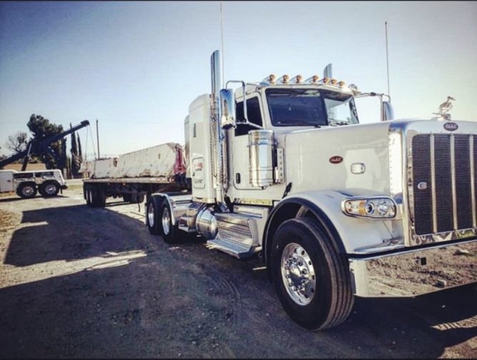Heavy Duty Flatbed Towing Truck towing cement barriers in Temecula CA - Rancho Towing