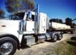 Heavy Duty Flatbed Towing Truck towing cement barriers in Temecula CA - Rancho Towing