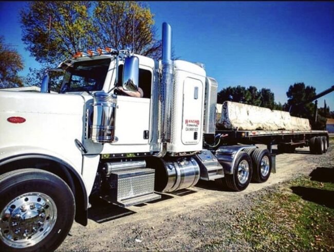 Heavy Duty Flatbed Towing Truck towing cement barriers in Temecula CA - Rancho Towing
